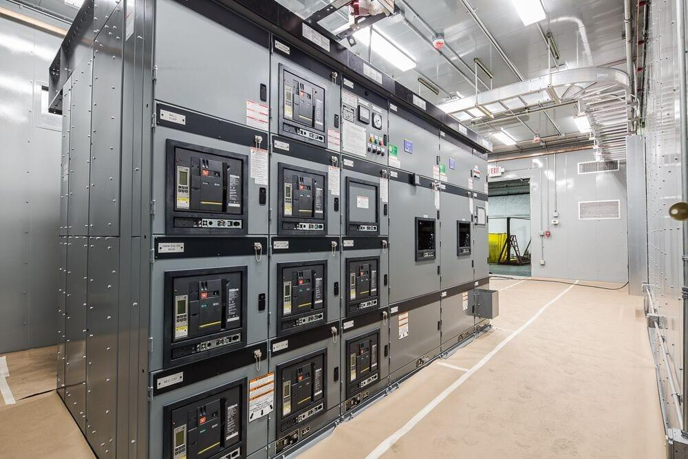 Modern electrical switchgear installed inside a commercial building power distribution room